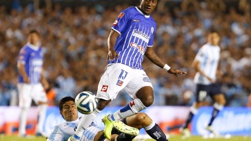 BUENOS AIRES, ARGENTINA - DECEMBER 14:  Jaime Ayovi of Godoy Cruz fights for the ball with Luciano Lollo of Racing Club during a match between Racing Club and Godoy Cruz as part of 19th round of Torneo de Transicion 2014 at Presidente Peron Stadium on December 14, 2014 in Buenos Aires, Argentina. (Photo by Gabriel Rossi/LatinContent/Getty Images)-Not Released (NR)