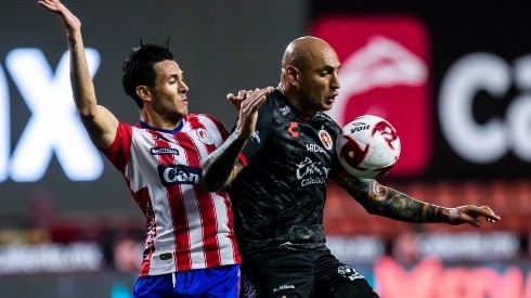 TIJUANA, MEXICO - AUGUST 12:Ramiro Gonzalez of Atletico San Luis and Ariel Nahuelpan of Tijuana compete for the ball during the 4th round match between Tjuana and Atletico San Luis as part of the Torne Guard1anes 2020 Liga MX at Caliente Stadium on August 12, 2020 in Tijuana, Mexico. (Photo by Francisco Vega/Getty Images)-Not Released (NR)
